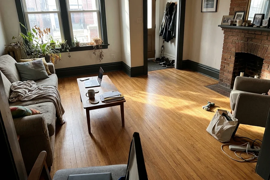 After hardwood refinishing Toronto: restored honey red oak in the same Rosedale semi from a different angle