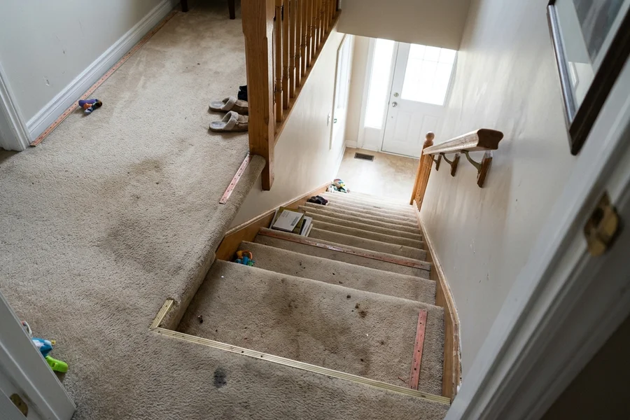 Before hardwood refinishing Toronto: 14-step carpet to oak recap in Leaside
