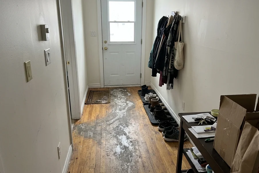 Before screen and recoat in Toronto: dull, salt-worn hallway