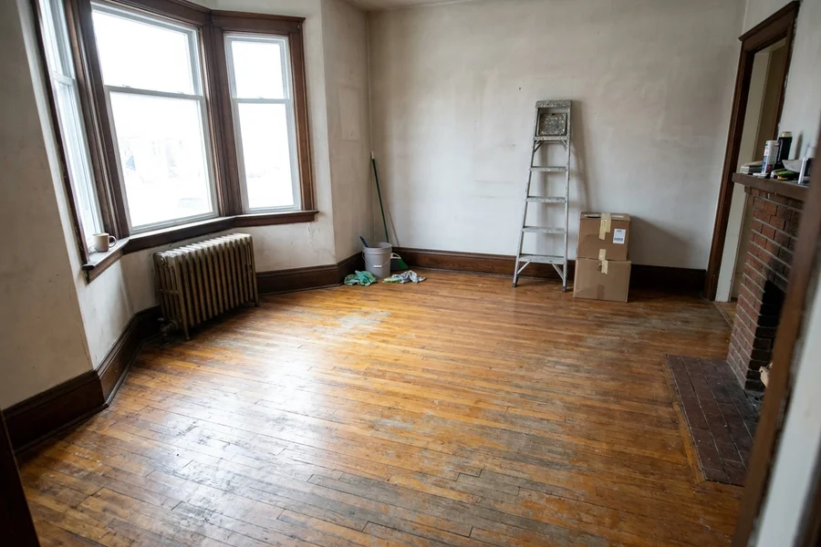Before hardwood refinishing Toronto: worn 1920s red oak in an empty Rosedale heritage semi