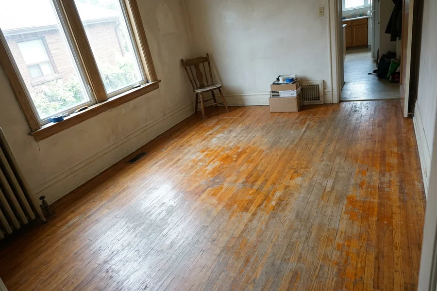 Before hardwood floor sanding in Toronto: worn red oak dining room