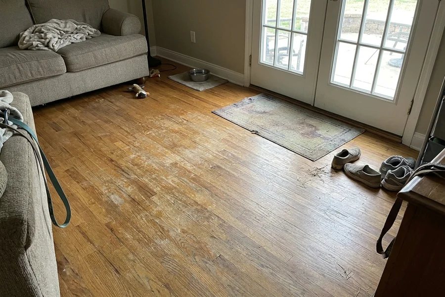 Before hardwood refinishing Toronto: family room oak, pet scratches removed in Willowdale