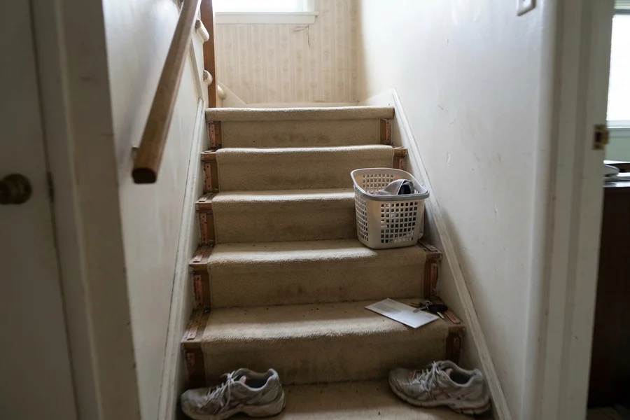 Before stair recapping Toronto: carpeted 1960s staircase in a Leaside bungalow