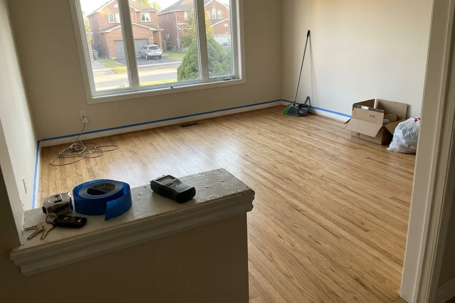 Freshly refinished oak floor in an empty GTA living room