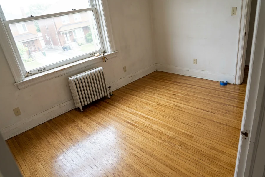 Freshly recoated oak floor in an empty North York rental unit