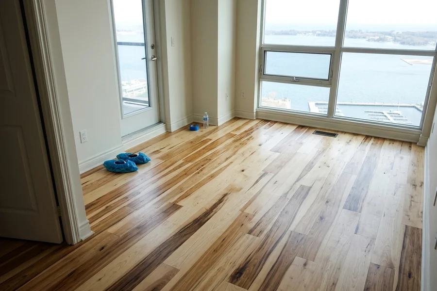 Engineered hickory after a light-grit refinish in a Harbourfront condo