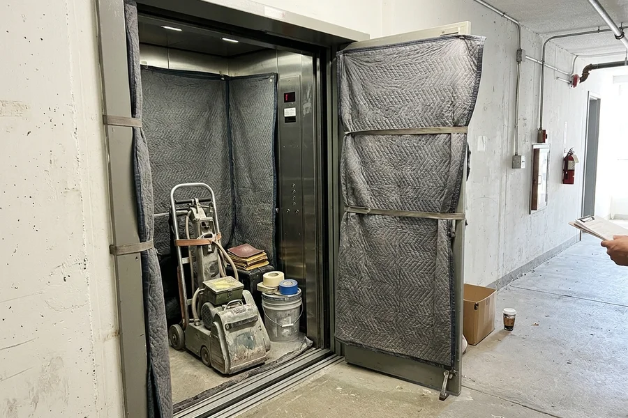 Protected freight elevator with sanding equipment for a Toronto condo job