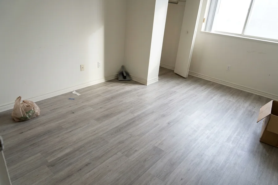 Oak-look vinyl plank in a North York rental bedroom