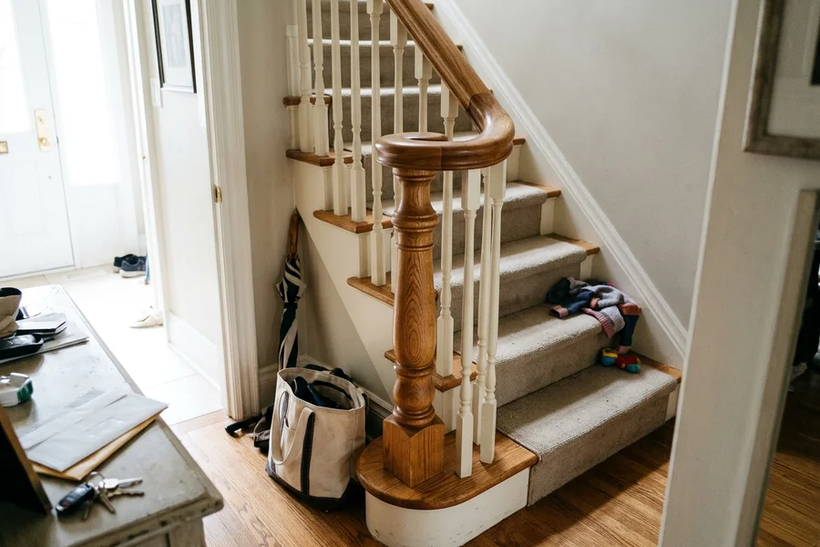 Refinished handrail and newel post on a Lawrence Park centre-hall staircase