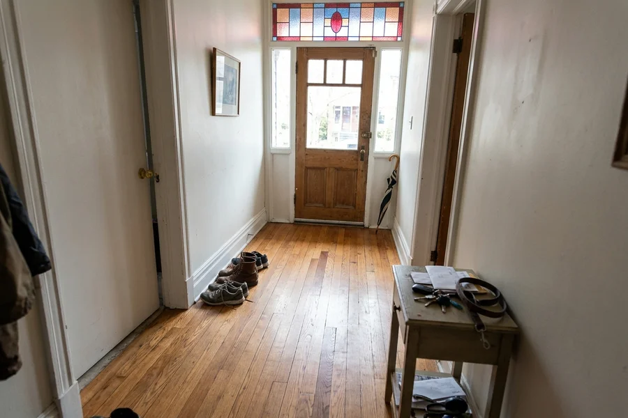Refinished red oak hallway after board repairs in a Riverdale semi