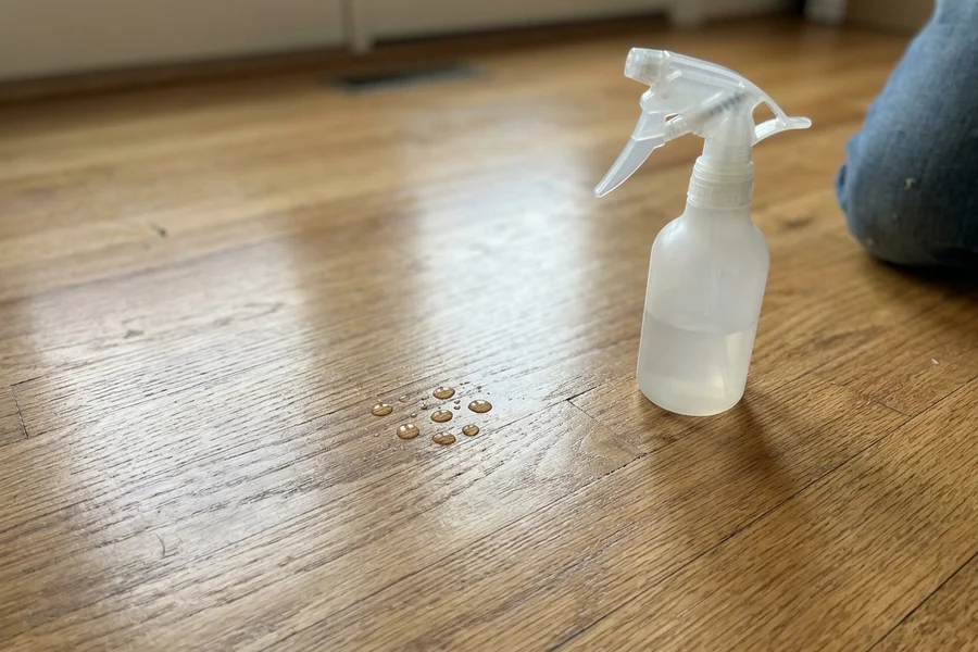 Water beading on an oak floor during a finish test before a recoat